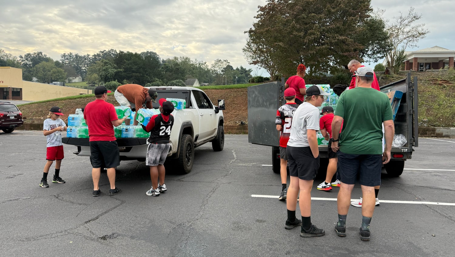 Couloak baseball team helping load supplies